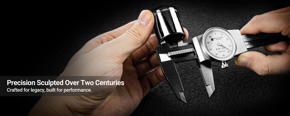Hands‑on measuring metal workpiece with Brown & Sharpe dial caliper, brand slogan banner